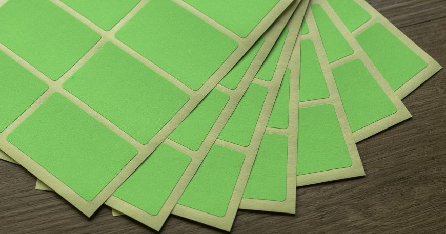 Seven sheets of green rectangular labels; all of the labels have a larger corner radius, which produces a rounded corner.