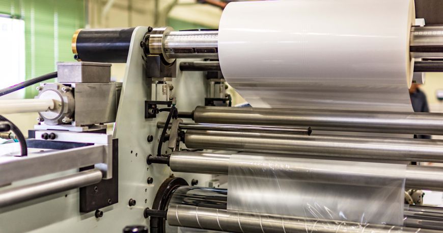 A roll of clear protective coat, which will be applied to a face material during the manufacturing process.