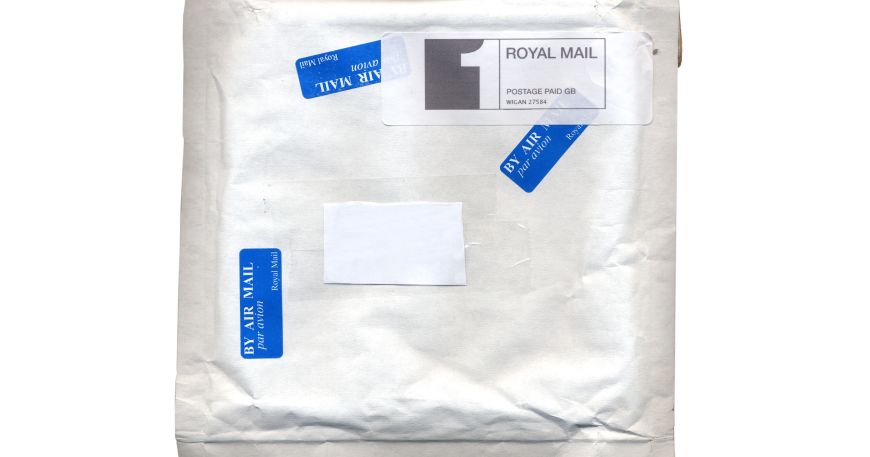 A white parcel with a smartstamp label applied in the top right corner.