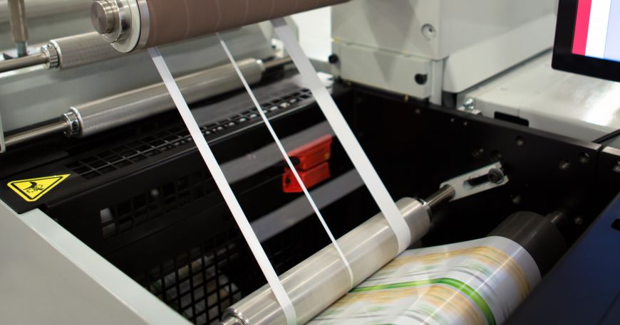 A machine removes the waste (top) during the production of roll labels. 