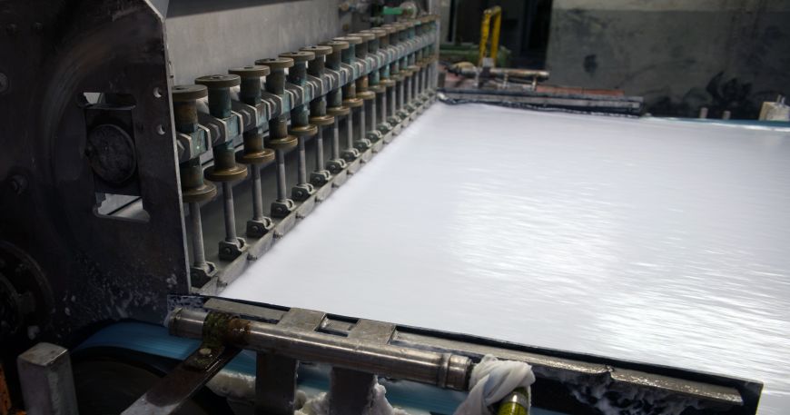 A web of paper being processed in a paper factory.