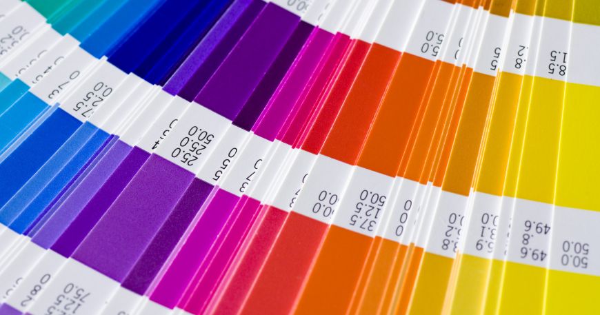 A close up of a Pantone sample catalogue; the catalogue shows a printed sample of each Pantone colour.
