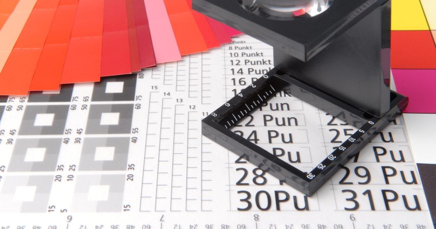 A reference sheet used to check the quality of printed materials. The sheet includes references for different font sizes and a ruler for measuring fonts in points.