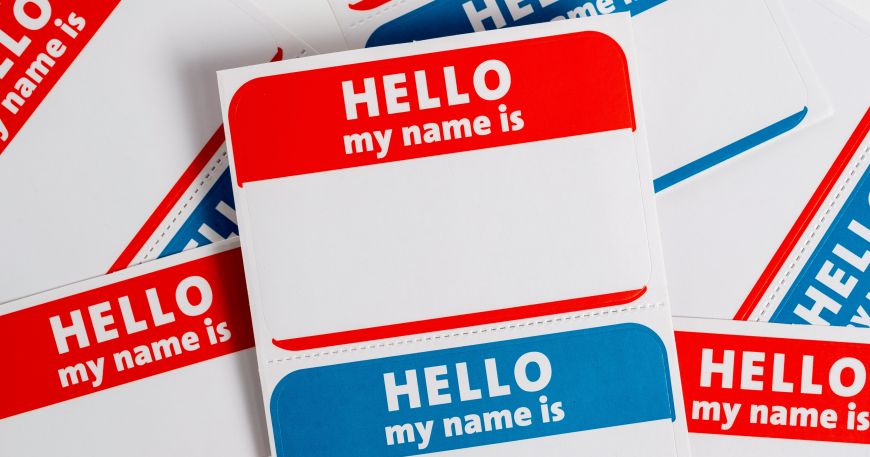 Sets of sticky name labels; the backing sheet is perforated between each label so they can be handed out individually. 