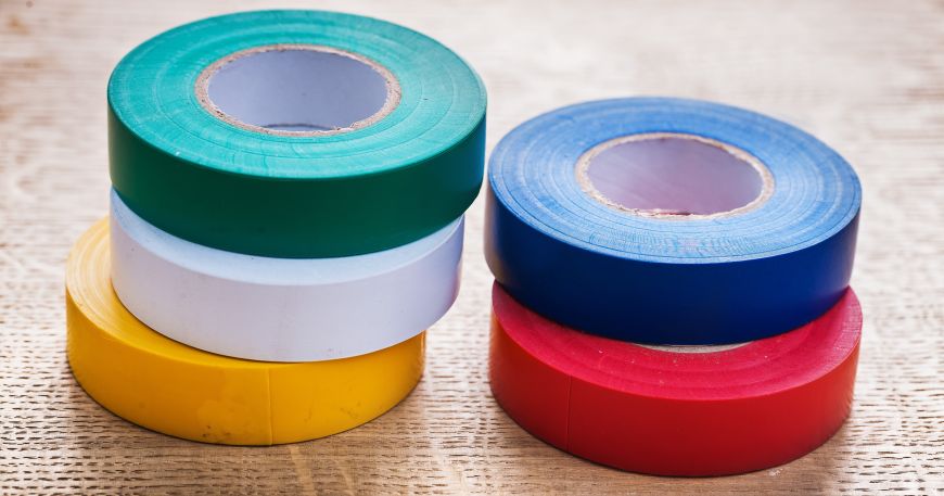 Five rolls of coloured insulating tapes; insulating materials have good dielectric strength.
