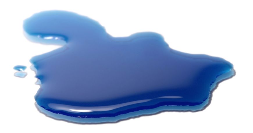 A blue coloured substance spreading across a white surface.