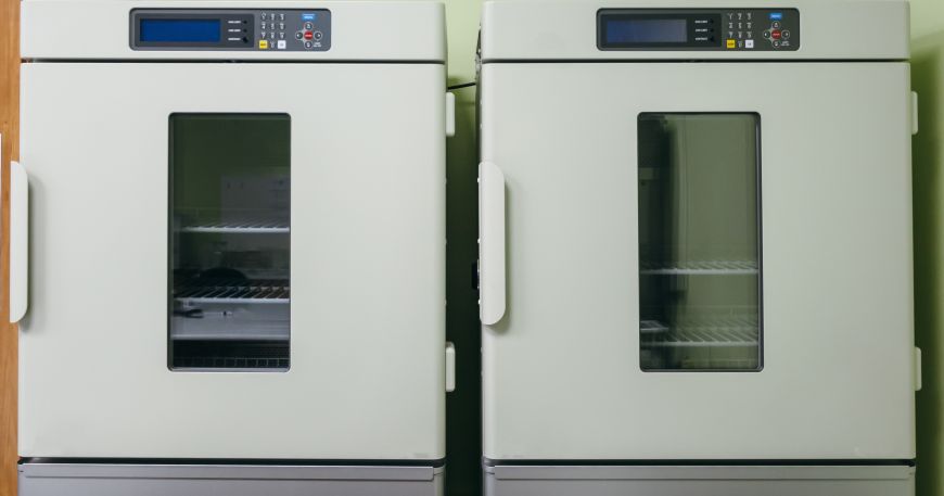 Two incubators in a laboratory; exposing materials to different temperatures is one way to perform accelerated aging tests.