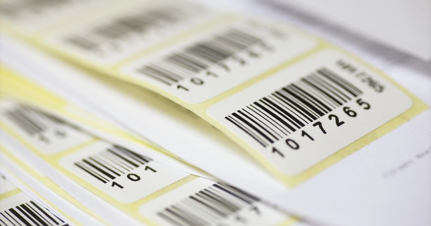 A set of asset ID labels; each label is printed with an asset ID number and a barcode.