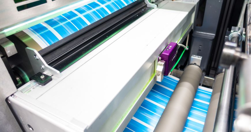 A printer being used to print a set of bespoke labels. 